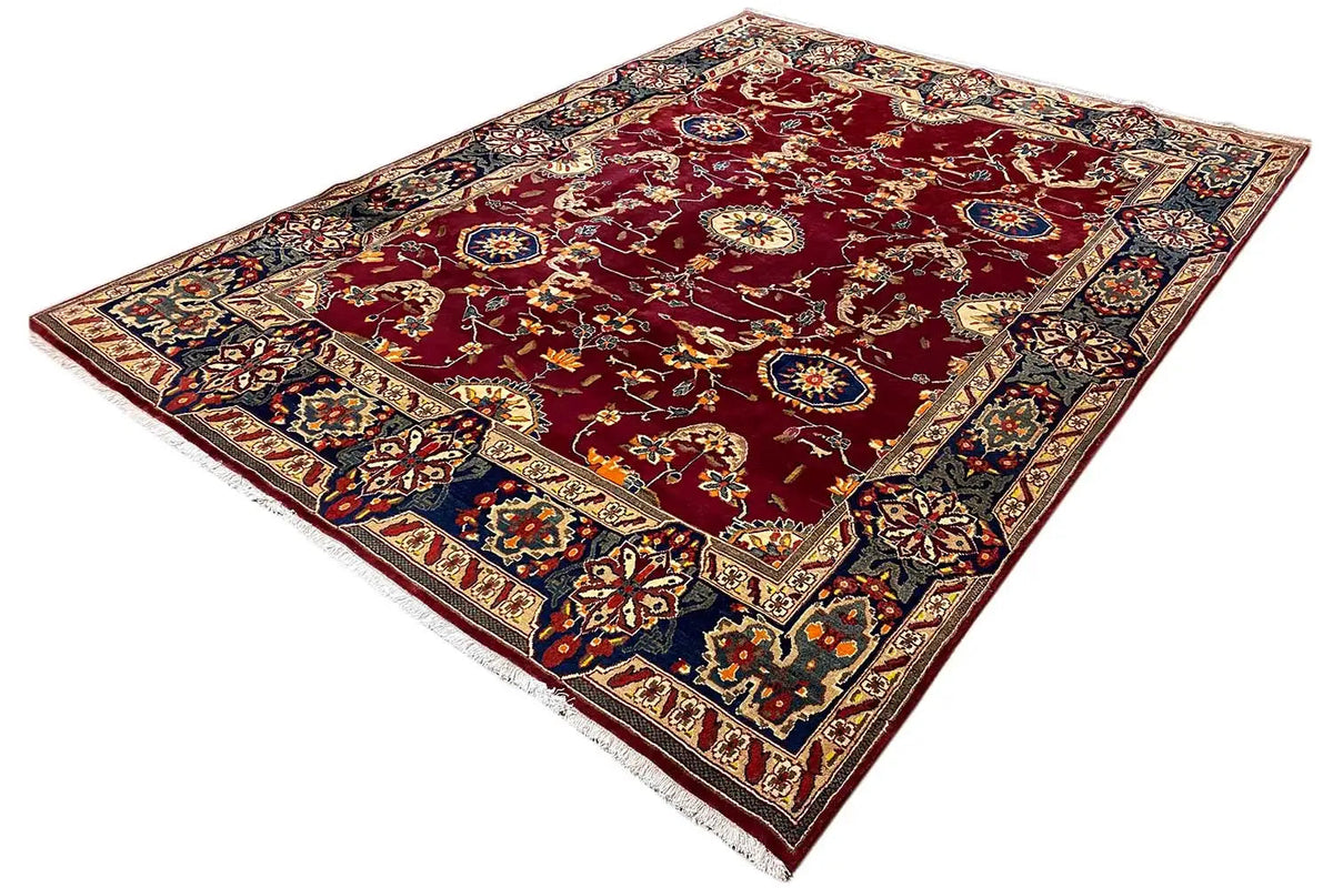 Bakhtiari rug, maroon background, finely ornamented border, diagonal view