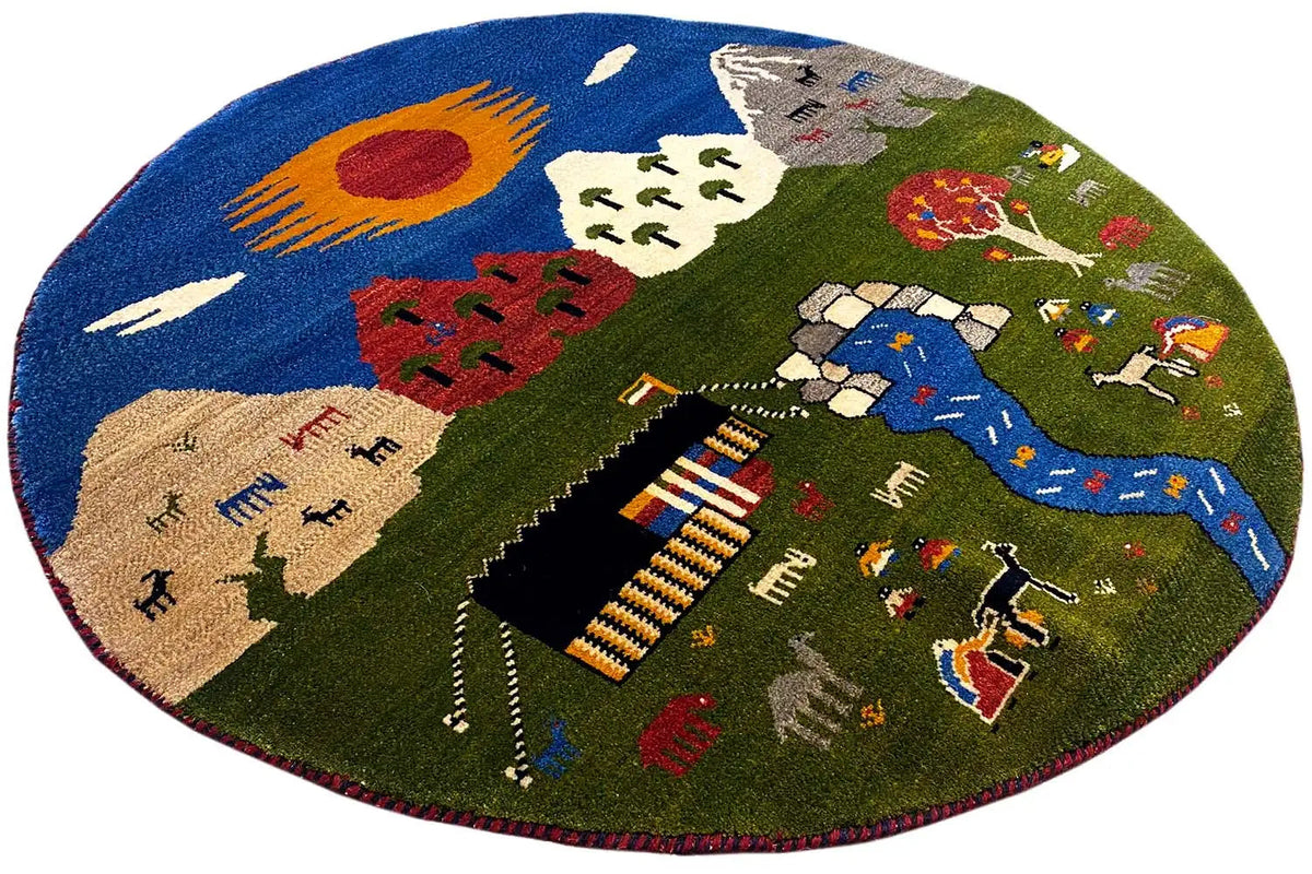 Round Gabbeh rug (101×101 cm) with a blue river, figures, and trees