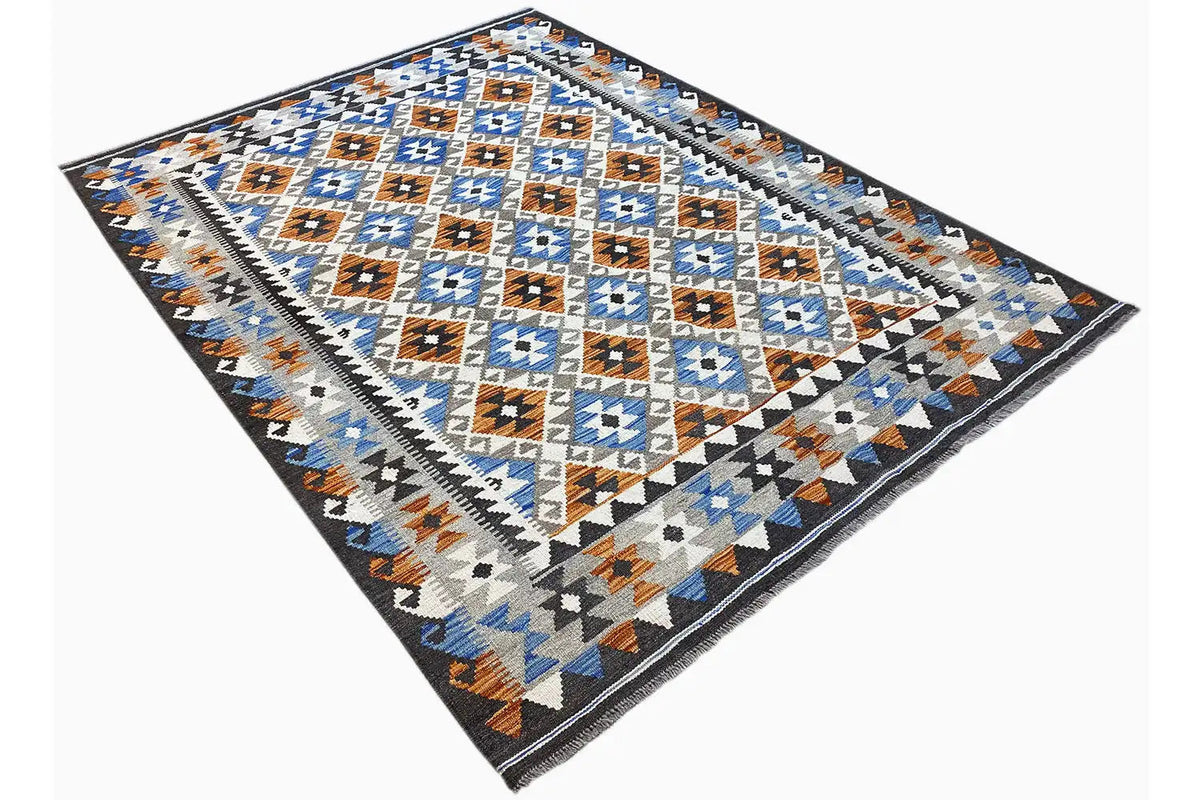 Afghan kilim rug with a diamond pattern, blue-and-white motifs, and brown accents