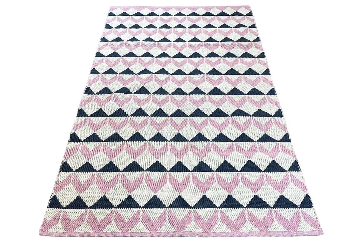 Kilim rug draped into a triangle, striped pattern in pink, white, and dark blue