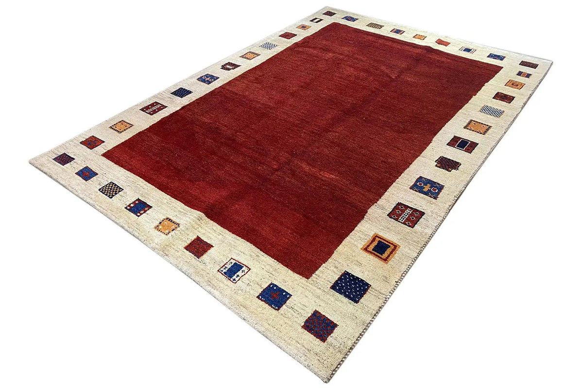 Gabbeh rug 297x202 cm, red central field with a multicolored border of squares
