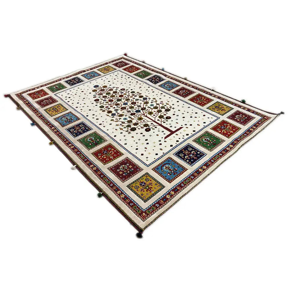 Square rug with a central tree, colorful border tiles, and corner ornaments