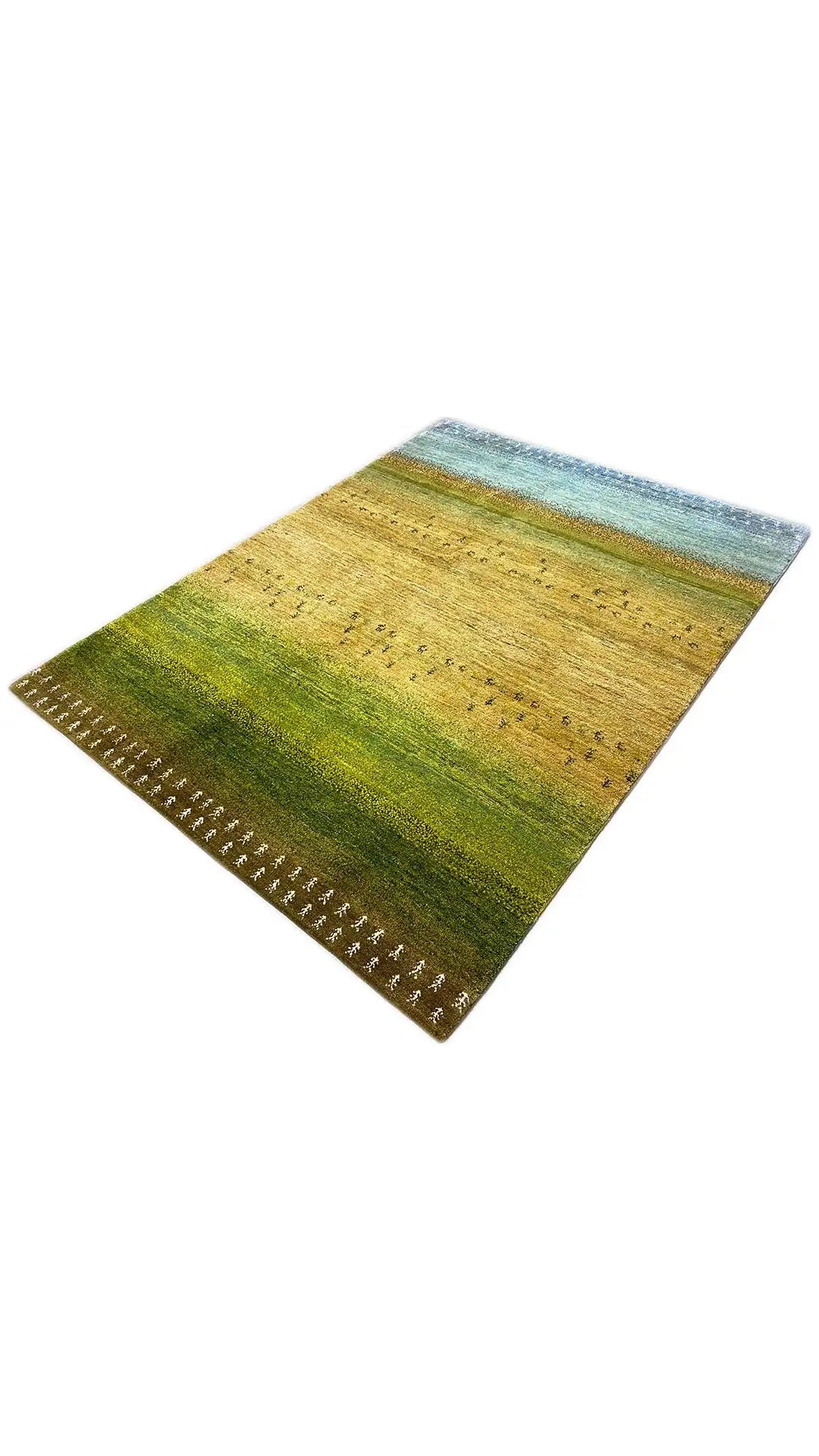 Gabbeh rug in oblique view, green and yellow pattern with bound edges