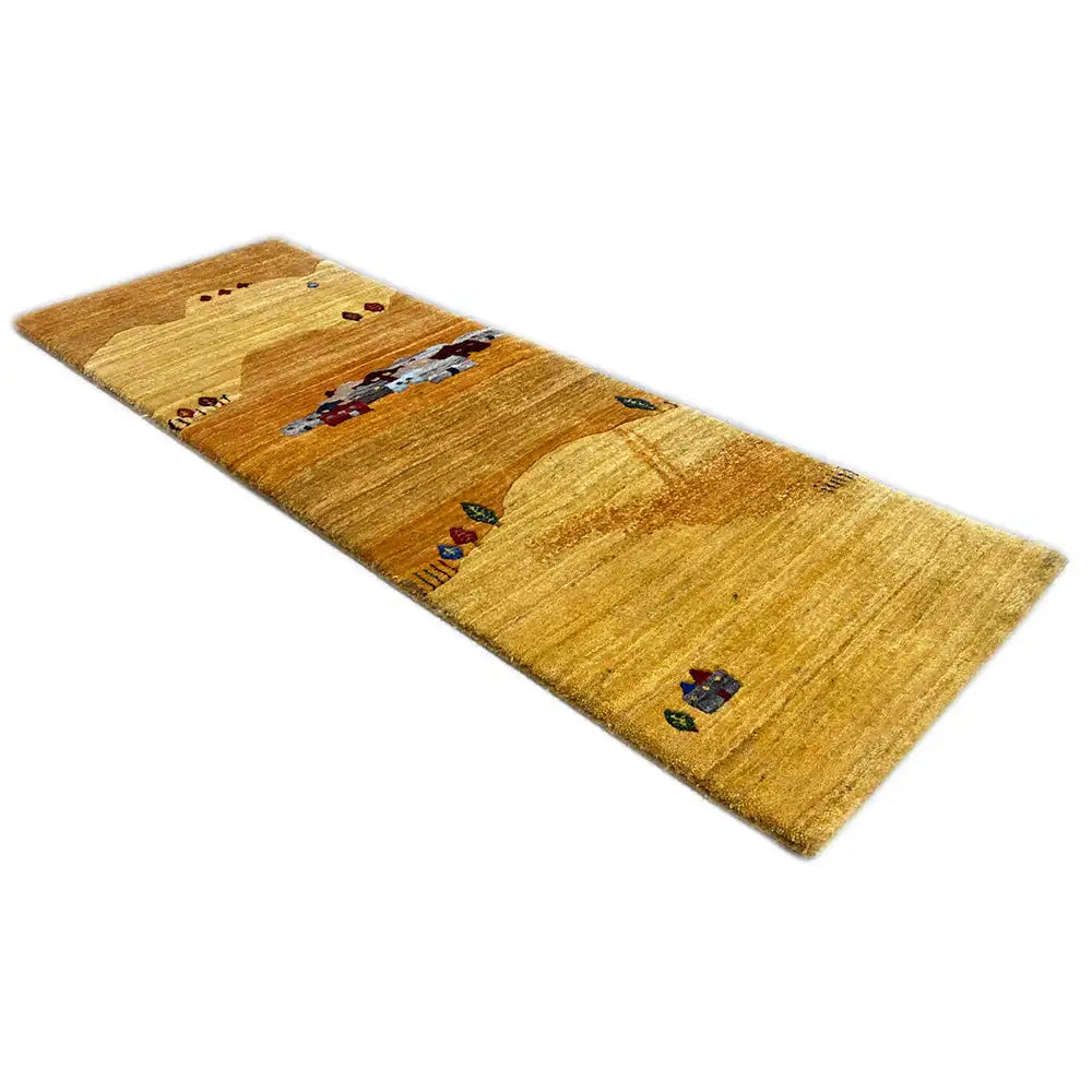 Gabbeh rug (runner), golden yellow with houses and colorful details, photographed horizontally