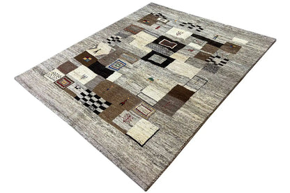 Rectangular rug with a gray background and patchwork details in brown, black, and red