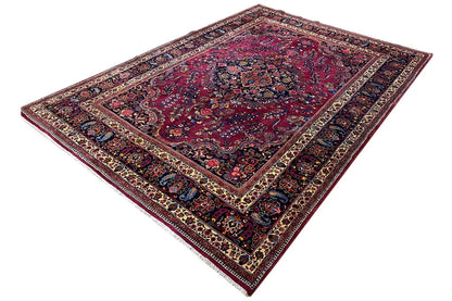 Red and dark blue rug with a medallion and multicolored borders