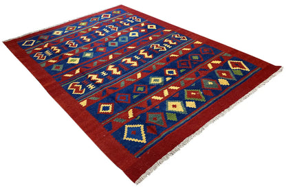 Kilim rug spread diagonally with blue and red sections