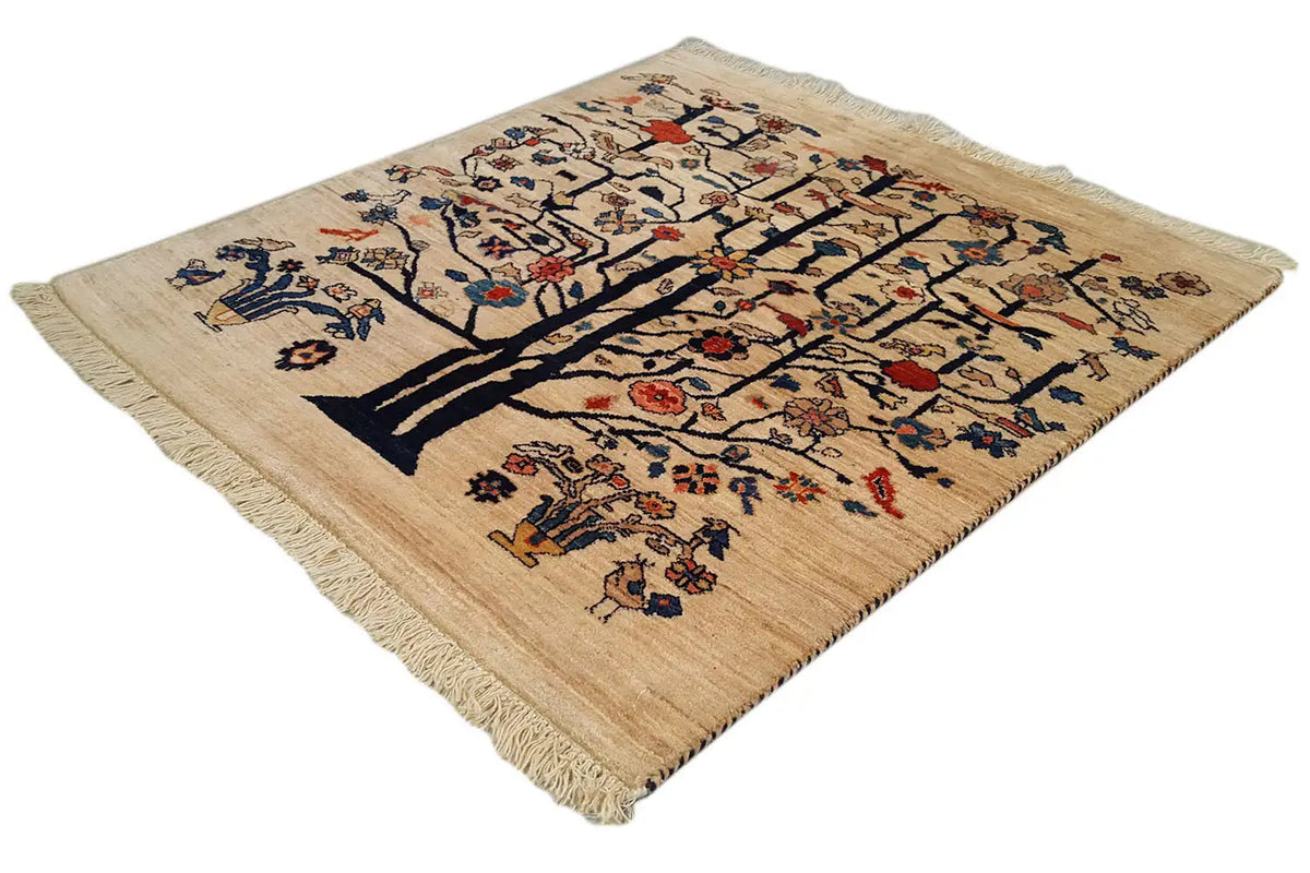 Square oriental rug with a tree motif, beige base, and colorful embroidery