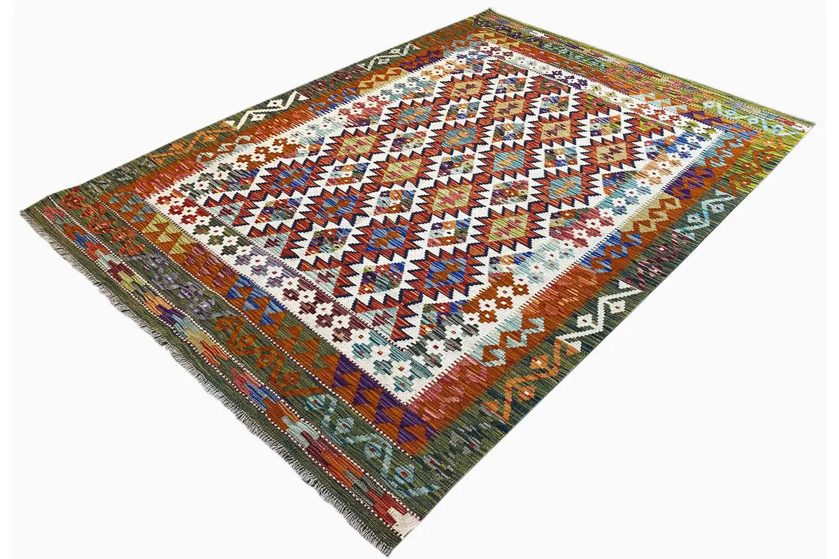 Kilim rug with border trim, zigzag pattern, and fringes on the sides