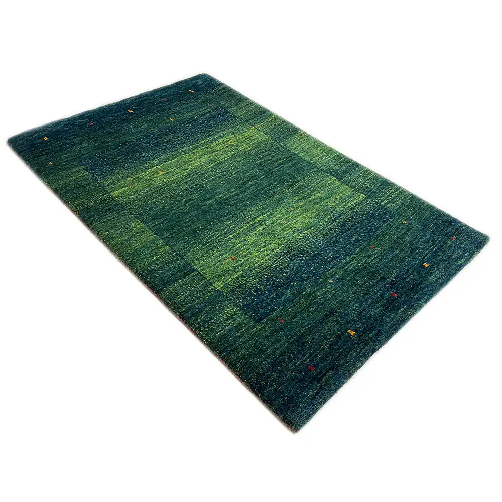 Gabbeh rug Lori, 98x64 cm: diagonal view of a striped pattern in shades of green and blue