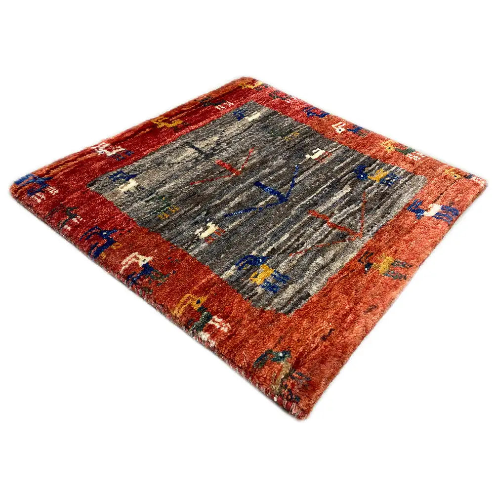 Square Gabbeh rug, diagonal, reddish-brown border, gray pattern with colorful motifs
