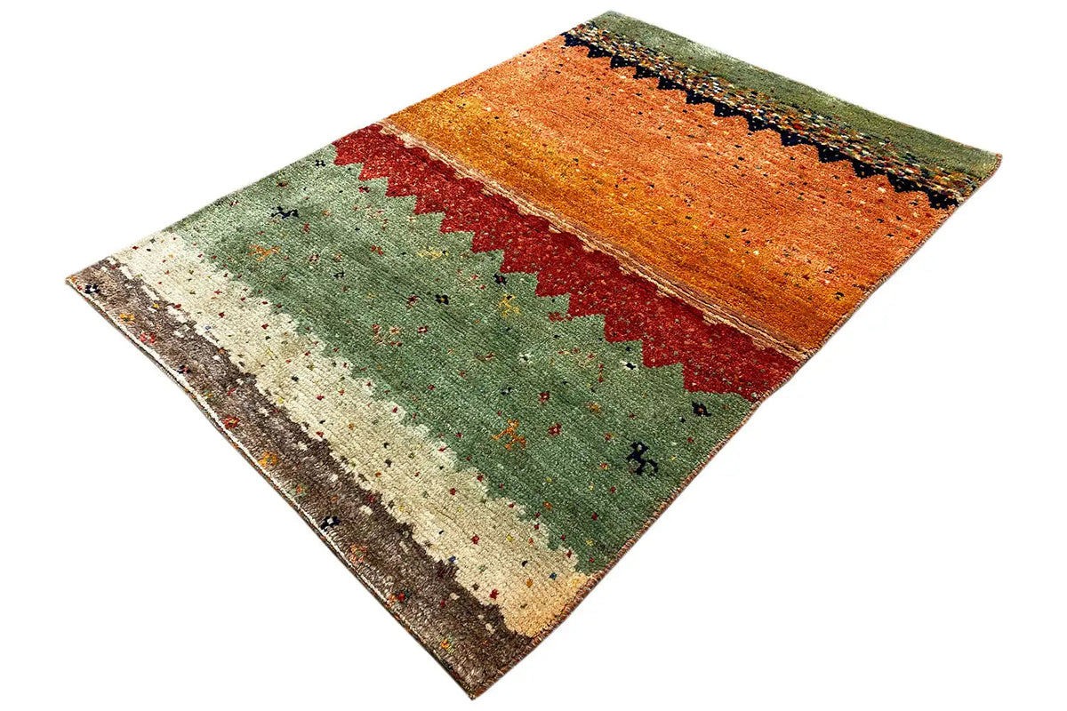 Gabbeh Lori rug with a diagonal view: orange upper surface, red-green stripes.