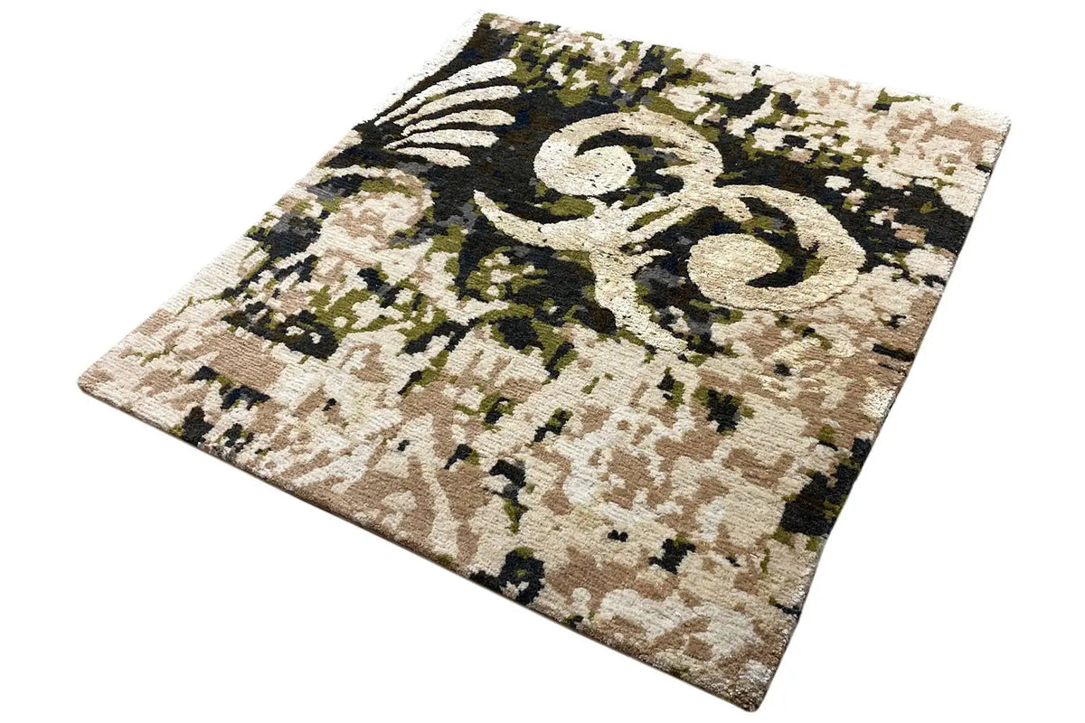 Square rug 60x60 cm, photographed at an angle, beige-and-black ornamental design