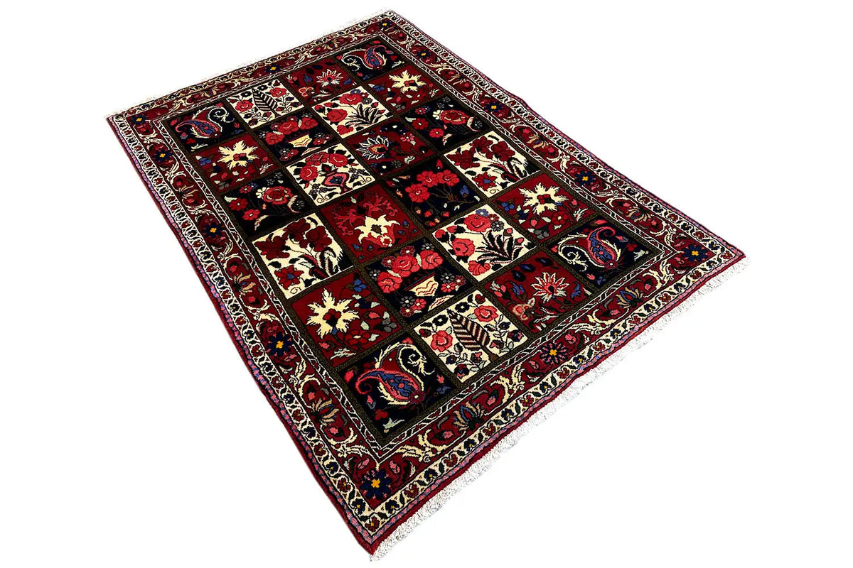 Bakhtiari rug (157x106 cm) laid out, geometric patchwork in red and dark blue