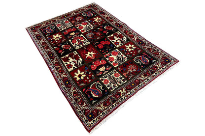Bakhtiari rug (157x106 cm) laid out, geometric patchwork in red and dark blue