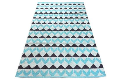 Carpet in a diamond and zigzag pattern; view of the width with a turquoise border band