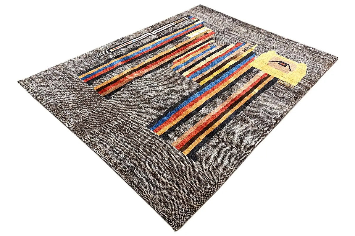 Low-pile rug viewed from above: gray background with colorful stripes and a yellow design.