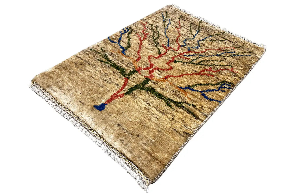Beige rug shown at an angle, ornamental pattern in red, blue, and green, with fringes
