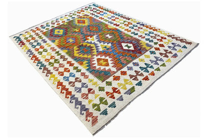 Afghan kilim with diamond and zigzag patterns, multicolored, spread out at an angle
