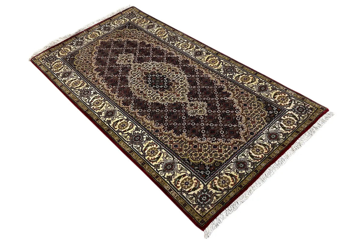 Indo Täbriz rug (145x76 cm) laid diagonally, dark pattern with beige ornamental borders