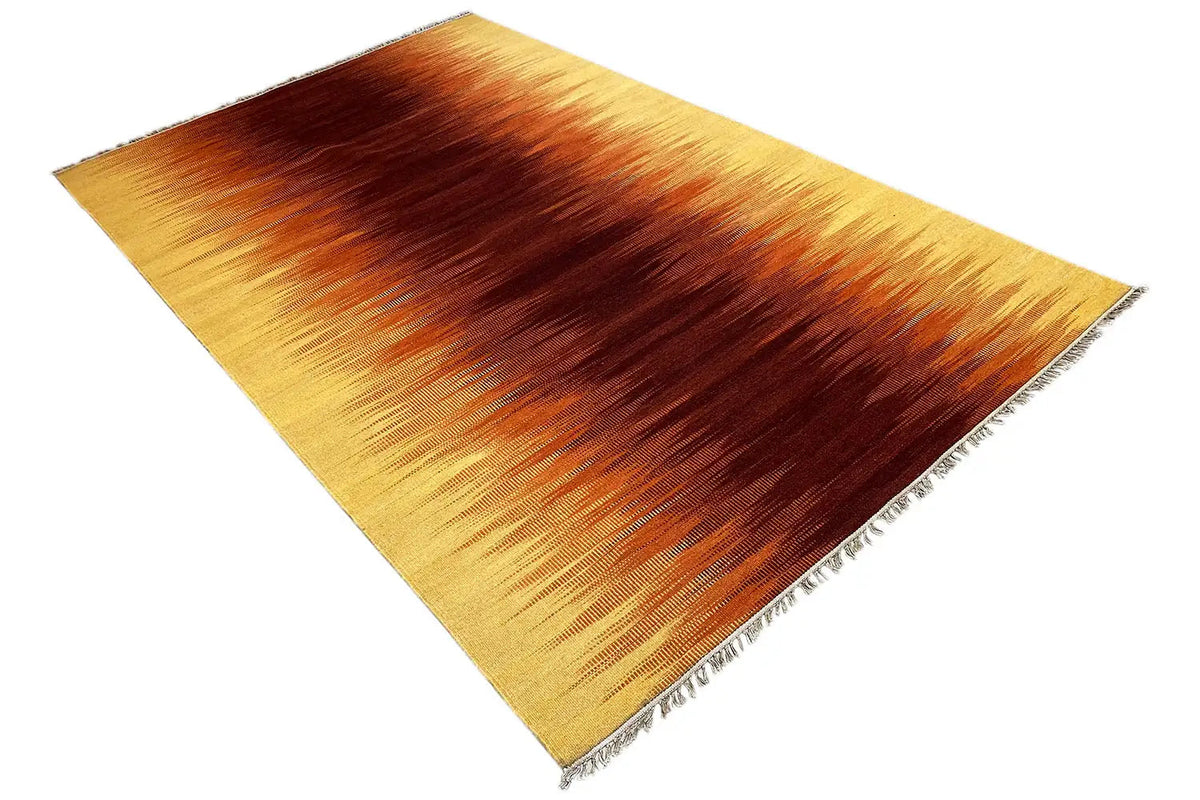 Kilim rug in yellow and brown with a diagonal effect, fringes along the edges