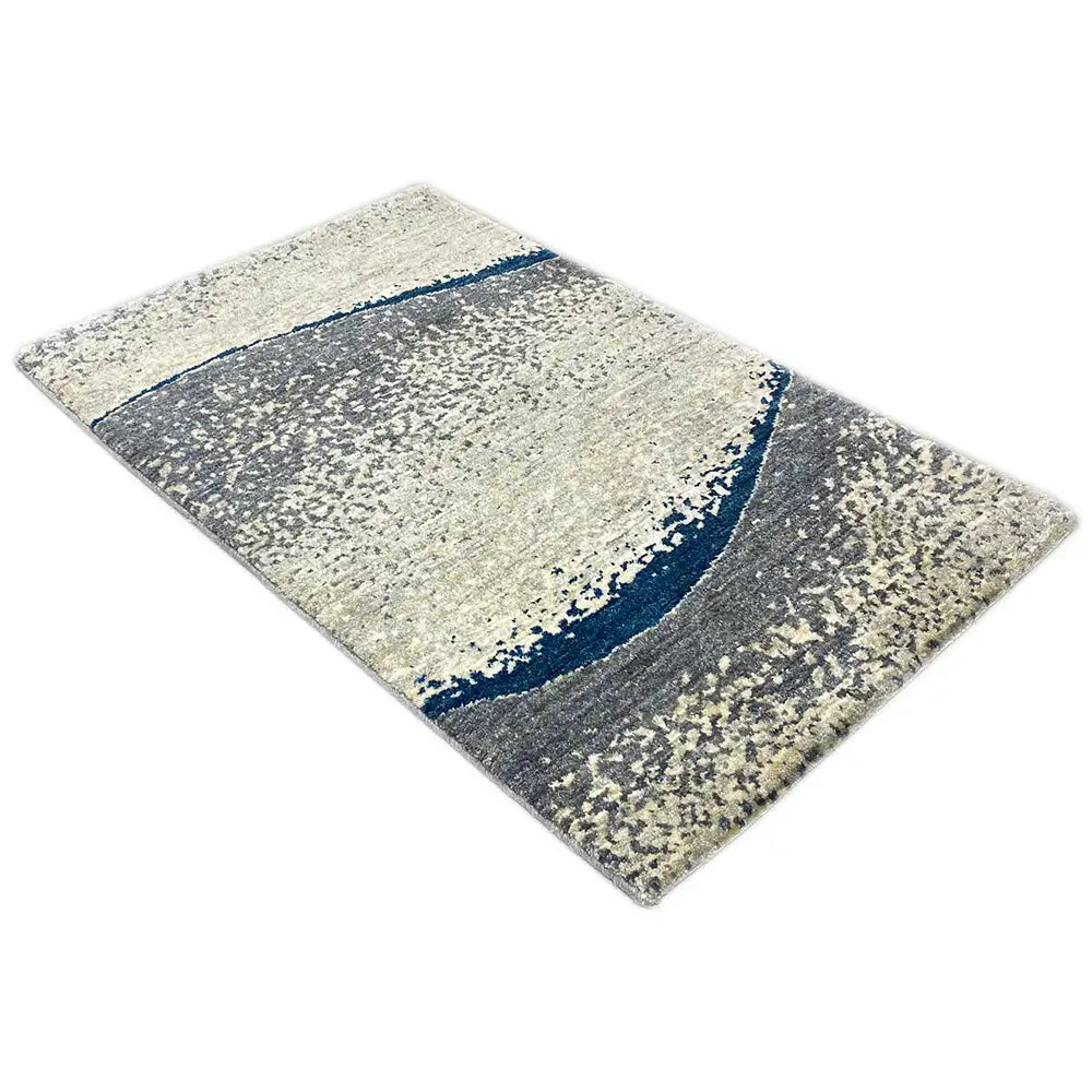 Gabbeh rug with a square appearance and an abstract pattern in light beige, gray, and dark blue