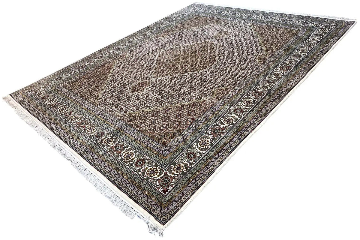 Indo Tabriz rug in brown and cream with patterned borders, fringes at the corners