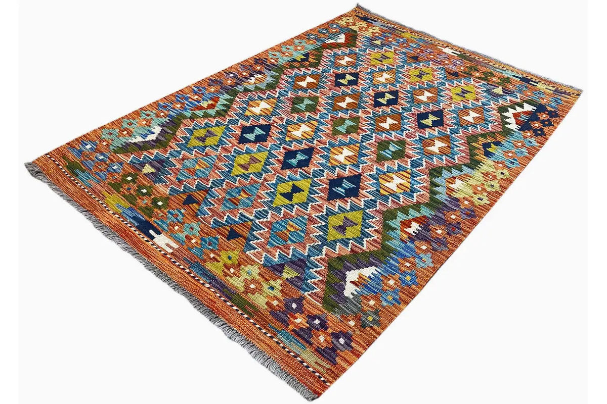 Afghan kilim rug 150x102 cm, diagonal view with colorful diamonds and fringes