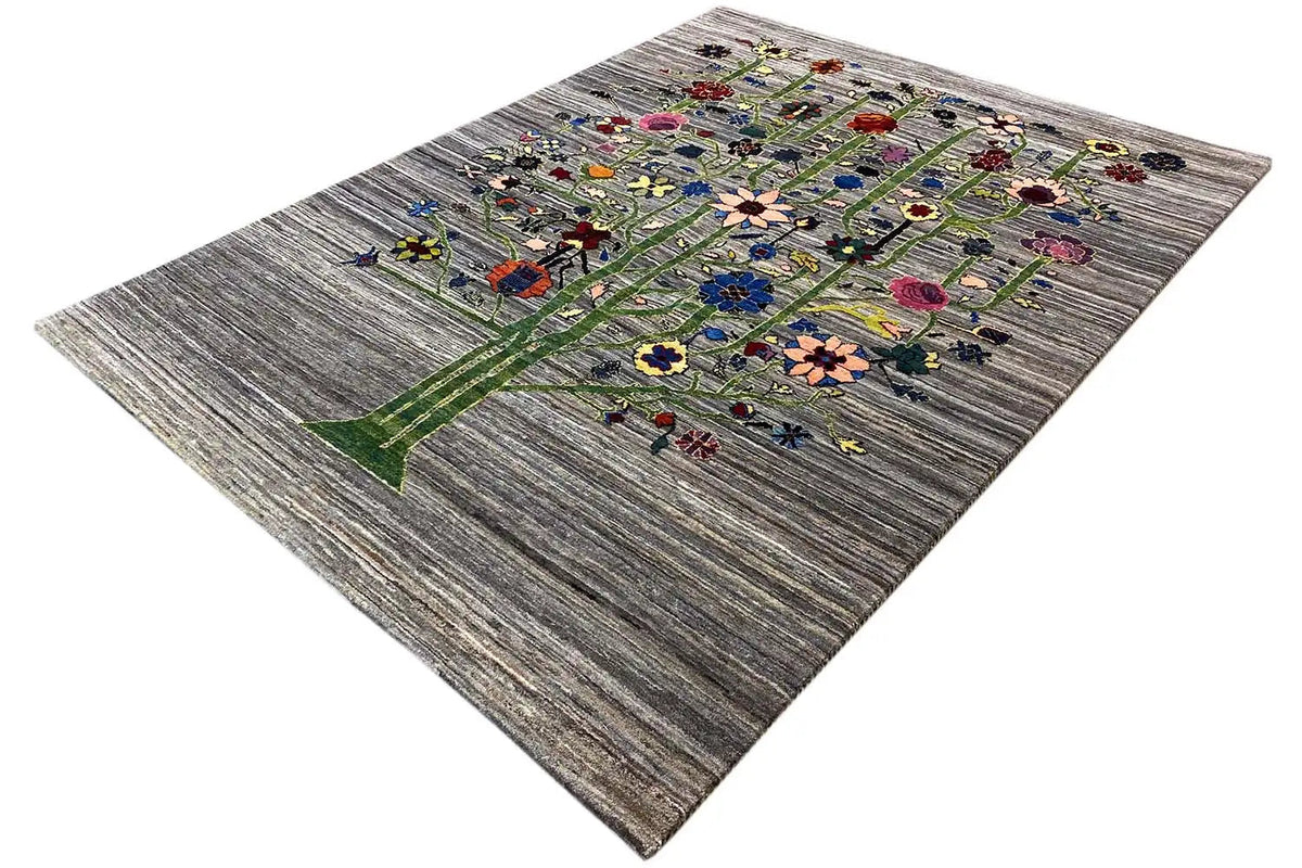 Gabbeh Lori rug in three-quarter view, gray field with a colorful tree motif