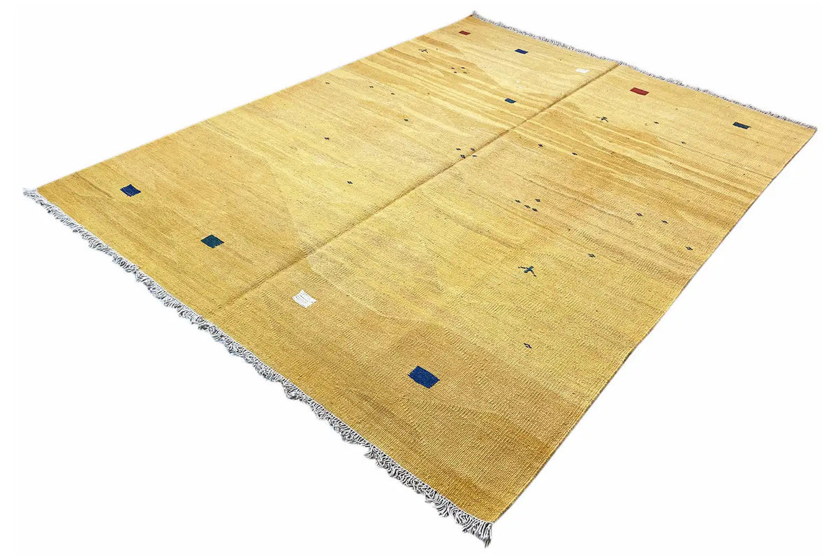 Ochre kilim rug with colorful squares, rectangular shape and fringes