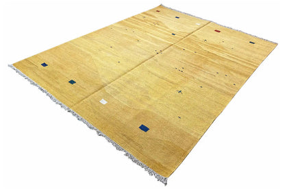 Ochre kilim rug with colorful squares, rectangular shape and fringes