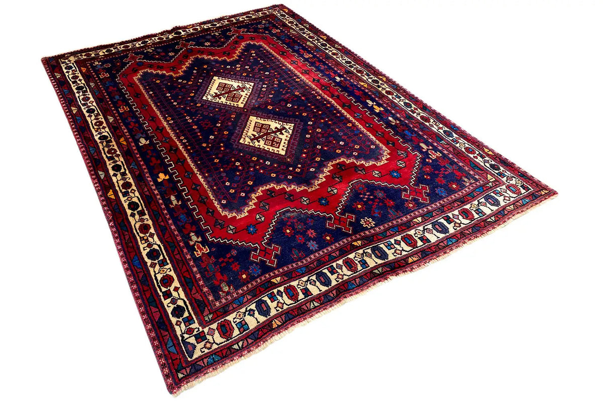 Sirjan carpet laid flat, blue-red ornamental pattern with a light border