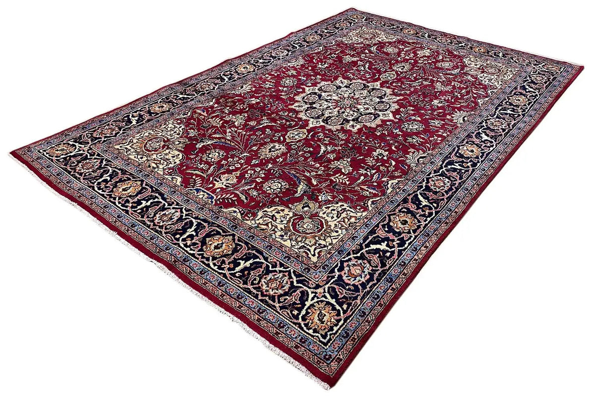 Khorasan rug: rectangular area with a red ornamental pattern and dark border.