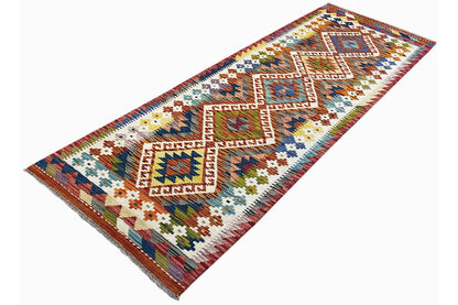 Kilim runner with large diamond and linear patterns in brown, blue, green, and beige, approx. 192x64 cm