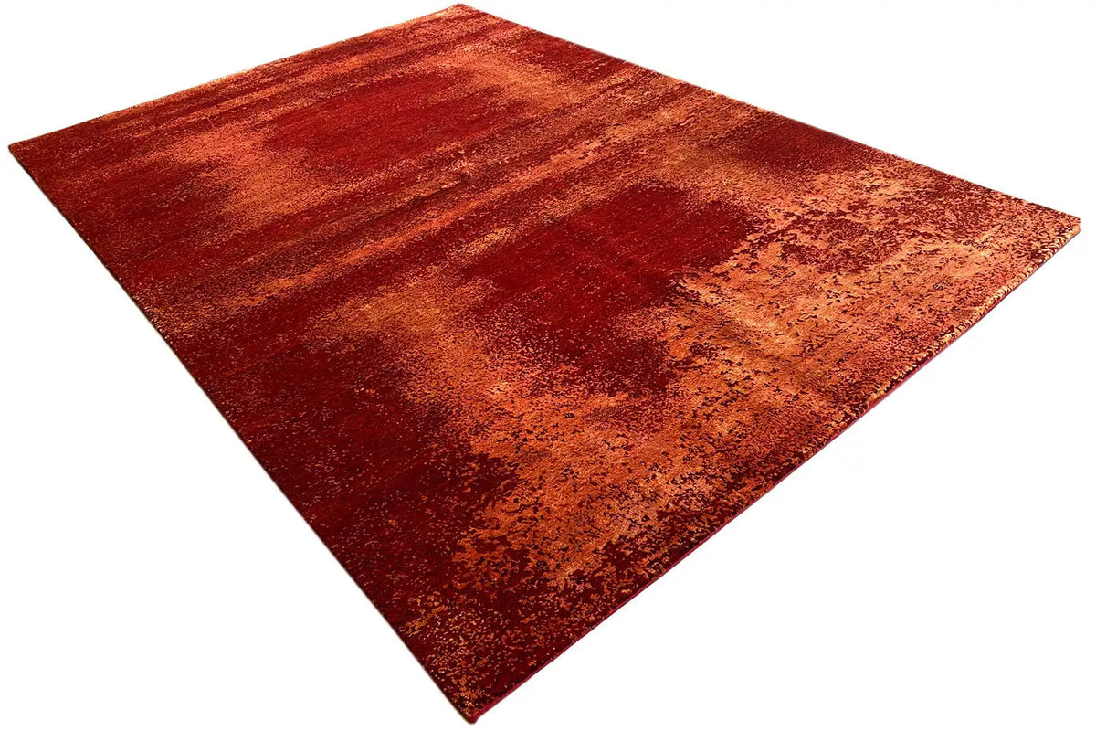Red carpet with darker flecks and a marbled pattern, diagonal view