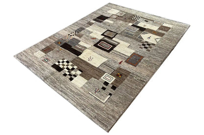 Gabbeh rug in gray and beige with abstract patchwork, diagonal view