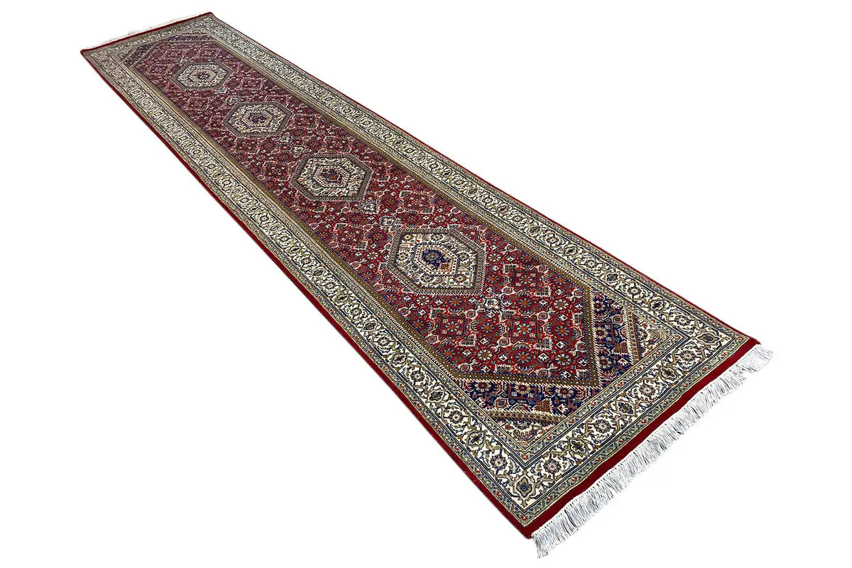 Bidjar runner rug, diagonal, with a multicolored ornamental border and white fringe along the edge