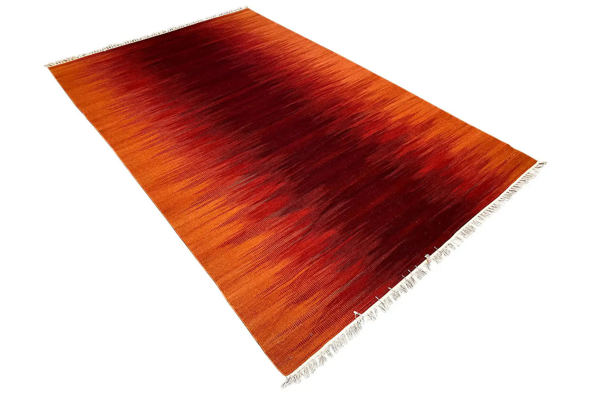 Kilim dhurrie rug, orange-red striped pattern, spread diagonally with fringes