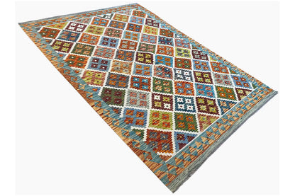 Kilim rug with a light blue background and diamond-square mosaic, colorful woven border