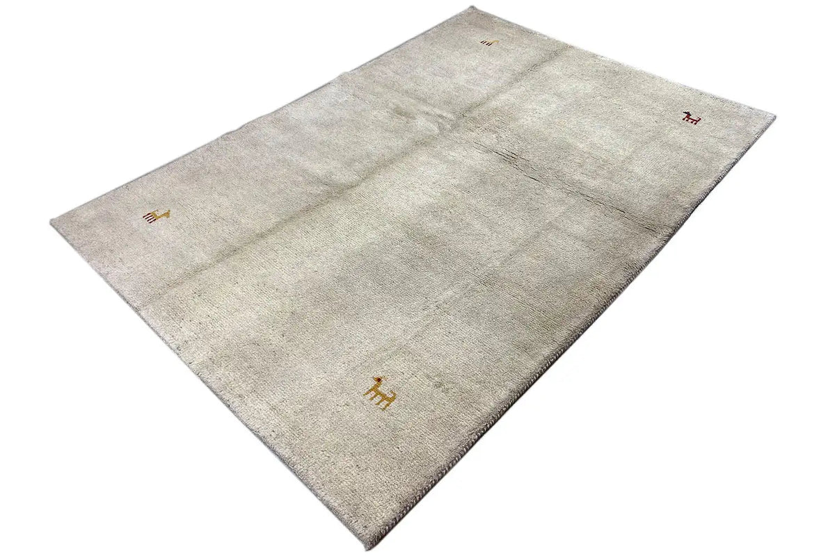 Rug (190x135 cm) in light gray, diagonal view with animal motifs in brown