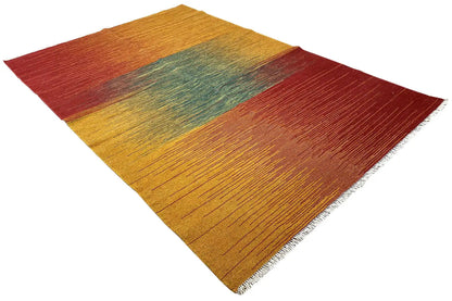 Kilim rug with diagonal color blocks in mustard, burgundy, and petrol, fringed selvedge
