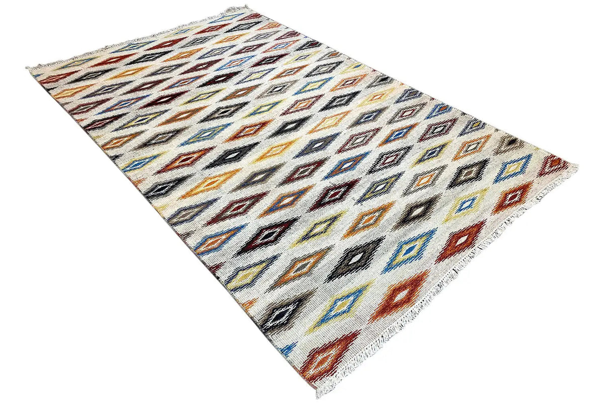 Kelim dhurrie rug in a diagonal view, geometric diamond and zigzag pattern
