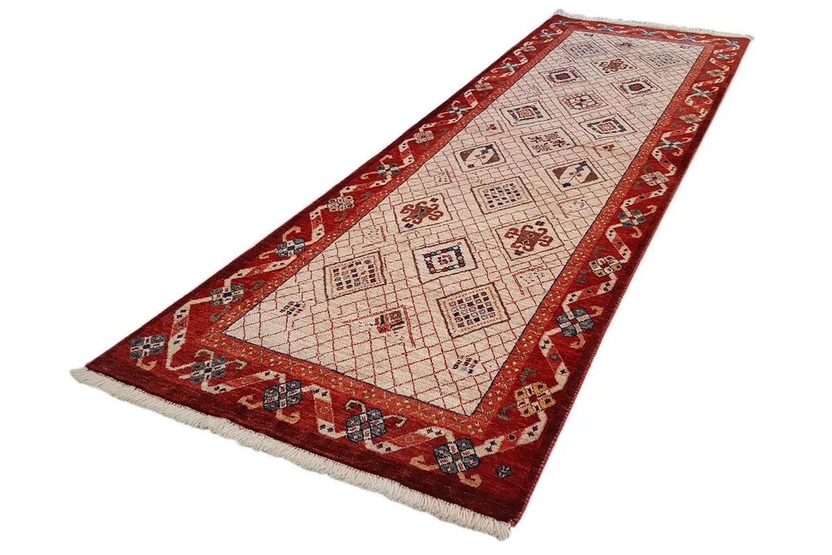 Exclusive Qashqai oriental rug with a red border, geometric pattern, and fringes