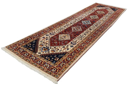 Runner rug with a red central medallion, blue border, and light-colored ornaments, woven