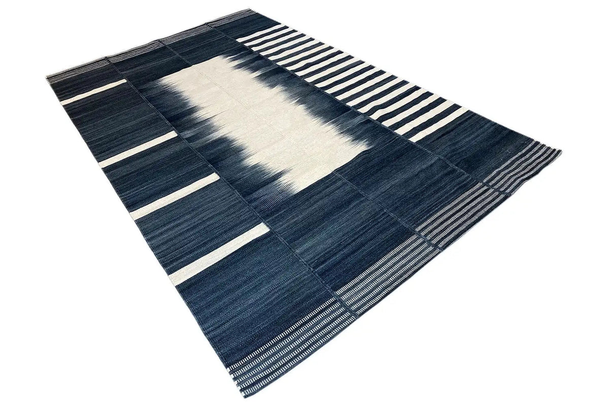 Modern kilim, laid at an angle, with a wide central stripe and striped border