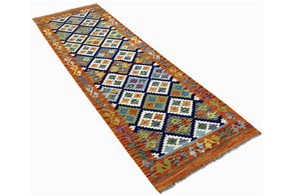 Afghan kilim runner rug, angled view, rectangular, with diamonds and multicolored squares