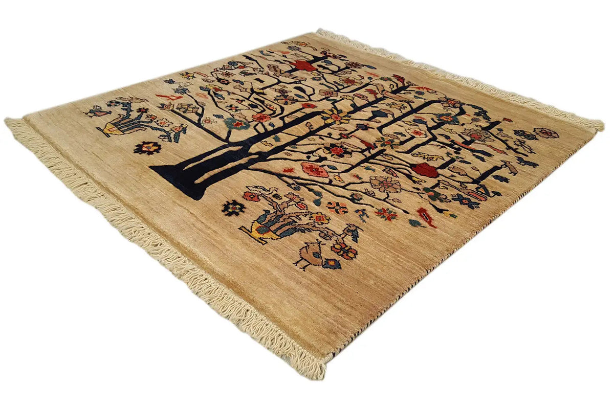 Square rug with a beige background and a colorful central tree motif