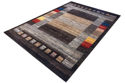 Gabbeh-Lori rug with wide stripes and color accents in red, blue, and yellow