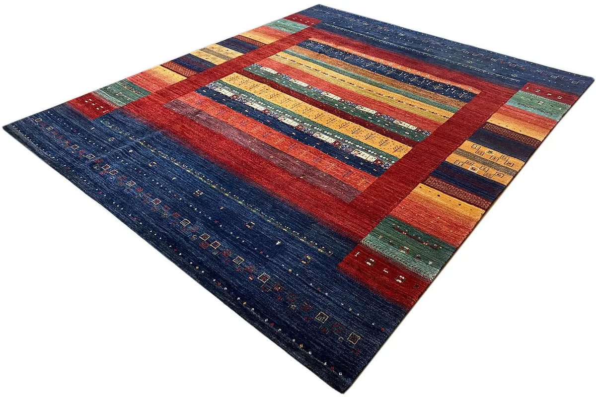 Rug diagonally with red border bands and multicolored stripes
