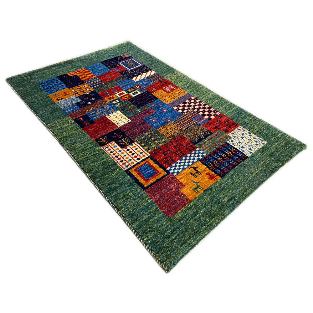 Gabbeh rug 96x60 cm in a patchwork look with a green border and colorful squares